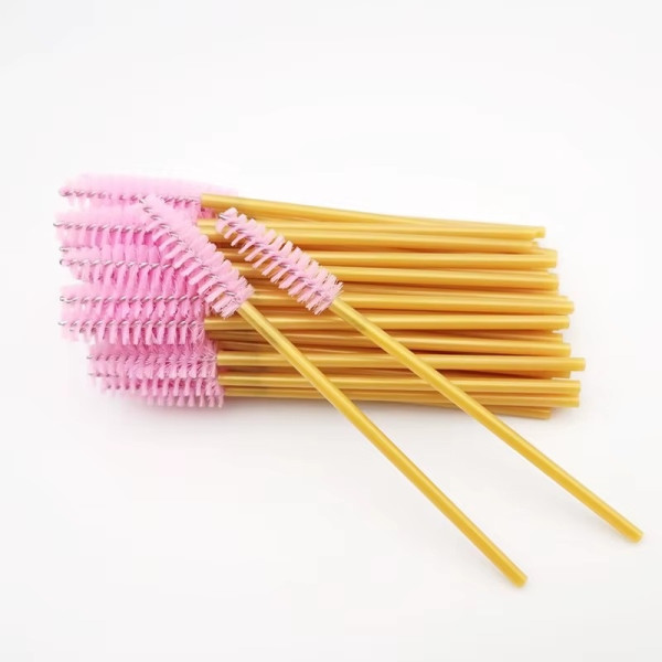 Eyebrow and eyelash brushes, nylon, with golden handle and pink bristles, 50 pcs